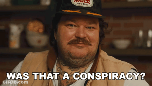 Man Wearing Hat That Says Muck Trucks GIF
