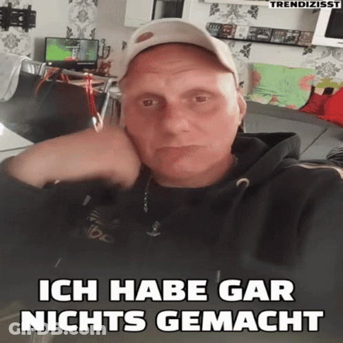 Man Wearing Hat With Ich Habe Gar Nichts Gemacht GIF