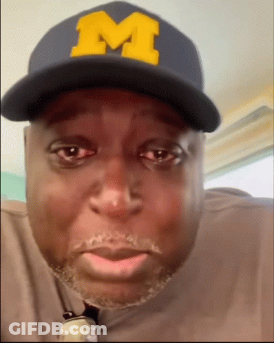 Man Wearing Hat With Yellow M GIF