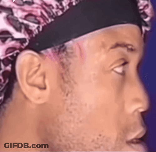 Man Wearing Headband And Leopard Print Hat GIF