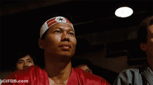 Man Wearing Headband With Chinese Symbol GIF