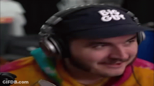 Man Wearing Headphones And Baseball Cap Smiling Playing Video Game GIF