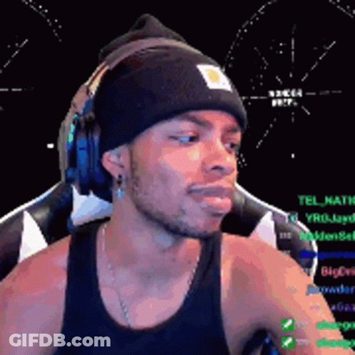Man Wearing Headphones And Beanie At Computer GIF