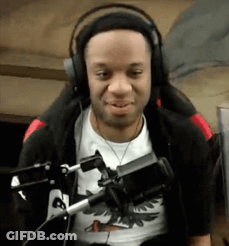 Man Wearing Headphones And Black Jacket At Microphone GIF