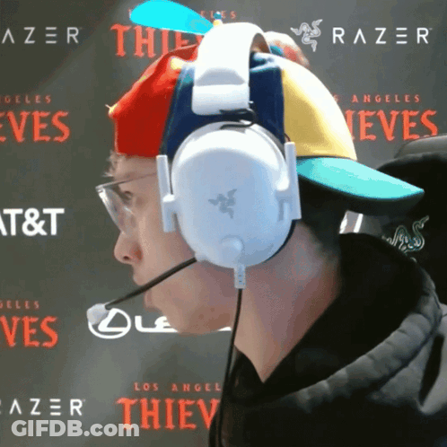 Man Wearing Headphones And Colorful Hat GIF