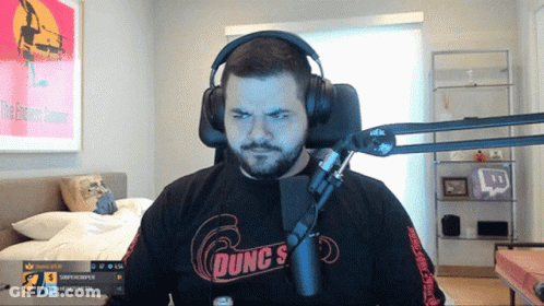 Man Wearing Headphones And Dunc's Shirt GIF
