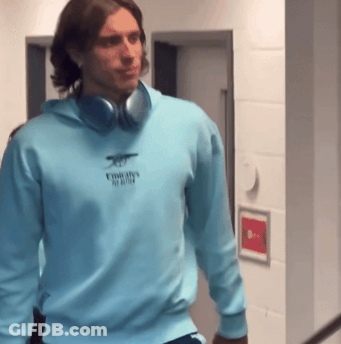 Man Wearing Headphones And Emirates Sweatshirt GIF