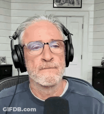 Man Wearing Headphones And Glasses At Microphone GIF
