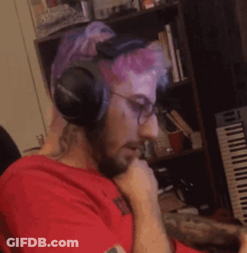Man Wearing Headphones And Glasses At Piano GIF