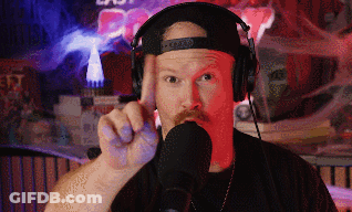 Man Wearing Headphones And Hat Pointing GIF