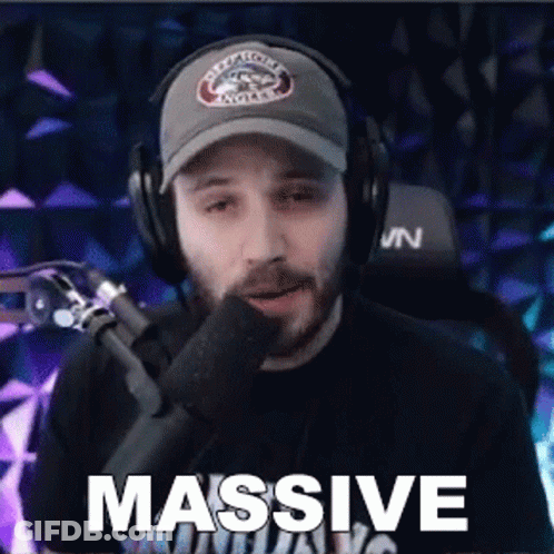 Man Wearing Headphones And Hat Saying Massive GIF