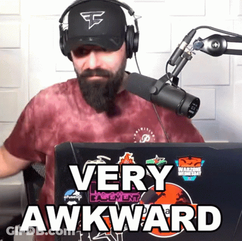 Man Wearing Headphones And Hat Says Very Awkward In Front Of Microphone GIF