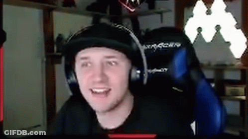 Man Wearing Headphones And Hat Sitting In Chair GIF