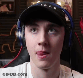 Man Wearing Headphones And Hat Sticking Out Tongue GIF
