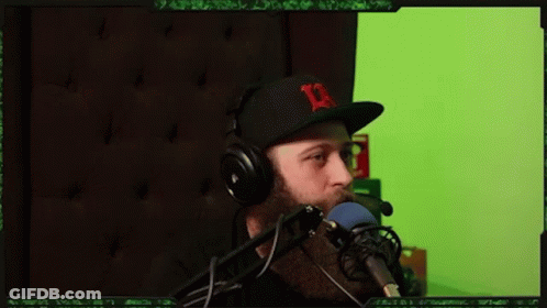 Man Wearing Headphones And Hat With D Speaking GIF