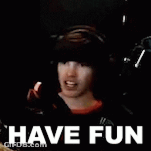 Man Wearing Headphones And Hat With Have Fun Behind Him GIF