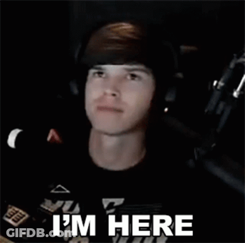 Man Wearing Headphones And Headband Says I'm Here GIF