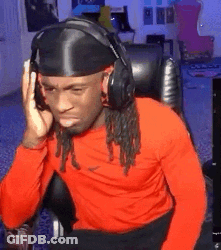 Man Wearing Headphones And Headband Sitting At Computer GIF