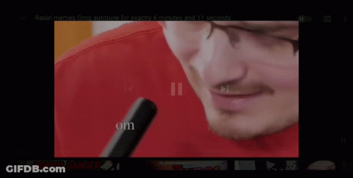Man Wearing Headphones And Red Puma Shirt Playing Flute GIF