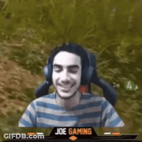 Man Wearing Headphones And Striped Shirt Sitting In Chair GIF