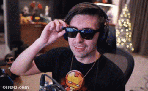 Man Wearing Headphones And Sunglasses In Iron Man Shirt GIF
