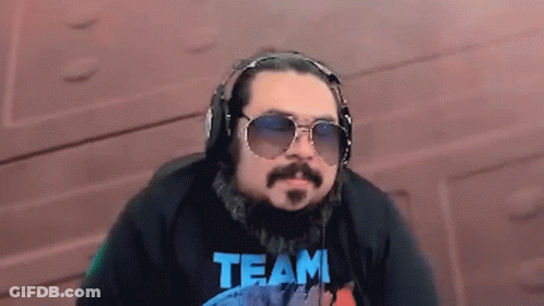 Man Wearing Headphones And Sunglasses With Team Shirt GIF