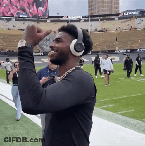 Man Wearing Headphones And Watch On Football Field GIF
