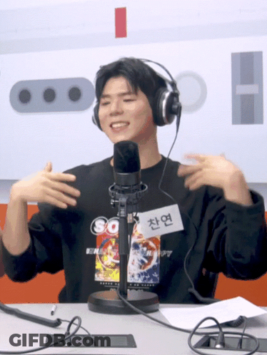 Man Wearing Headphones At Microphone GIF