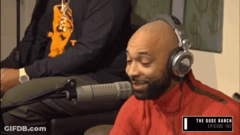 Man Wearing Headphones At Microphone GIF