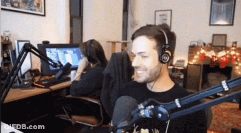 Man Wearing Headphones At Rode Microphone GIF