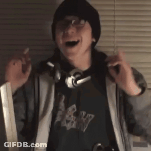 Man Wearing Headphones Dancing In Front Of Window GIF