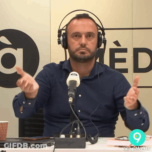 Man Wearing Headphones Giving Thumbs Up GIF
