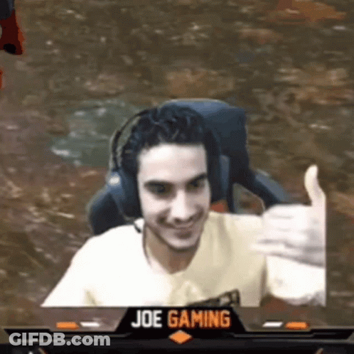 Man Wearing Headphones Giving Thumbs Up In Front Of Joe Gaming Logo GIF