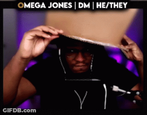 Man Wearing Headphones Holding Cardboard In Front Of Omega Sign GIF