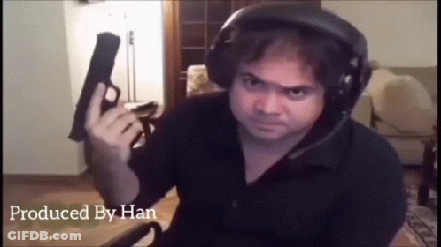 Man Wearing Headphones Holding Gun GIF