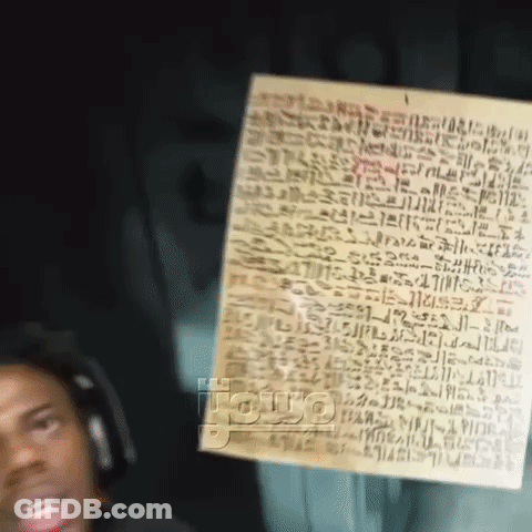 Man Wearing Headphones Holding Paper With Writing GIF