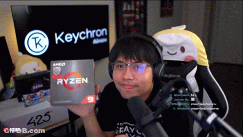 Man Wearing Headphones Holding Ryzen 9 Box GIF
