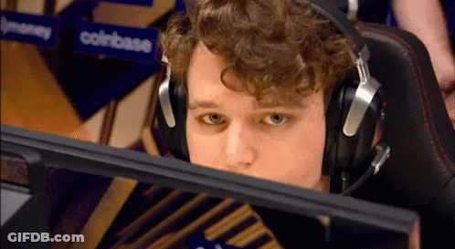Man Wearing Headphones In Front Of Coinbase Sign GIF