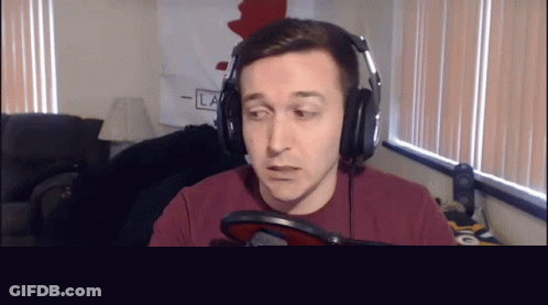 Man Wearing Headphones In Front Of Microphone GIF