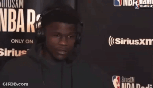 Man Wearing Headphones In Front Of Sirius XM GIF