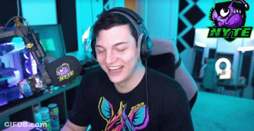 Man Wearing Headphones In Gaming Room GIF