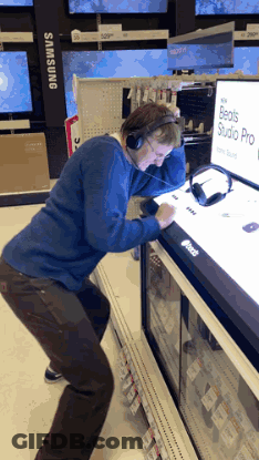 Man Wearing Headphones Looking At Beats Studio Pro GIF