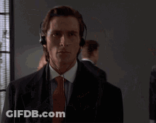 Man Wearing Headphones Looking At Camera GIF