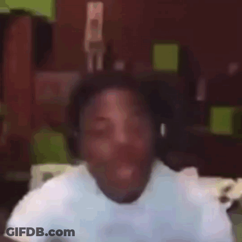 Man Wearing Headphones Making Funny Face Holding Cell Phone GIF