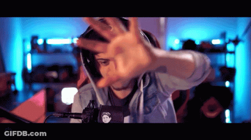 Man Wearing Headphones Making Hand Gesture GIF