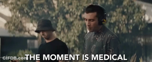 Man Wearing Headphones Next To Man In Bucket Hat GIF
