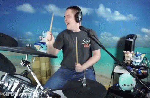 Man Wearing Headphones Playing Drums GIF