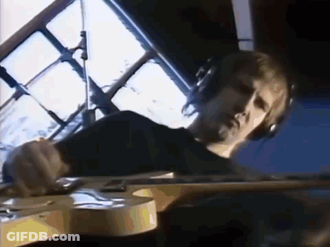 Man Wearing Headphones Playing Guitar GIF