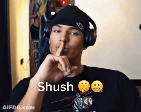 Man Wearing Headphones Saying Shush GIF