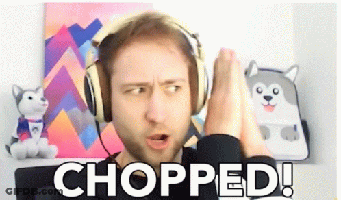 Man Wearing Headphones Says Chopped In Front Of Stuffed Husky GIF